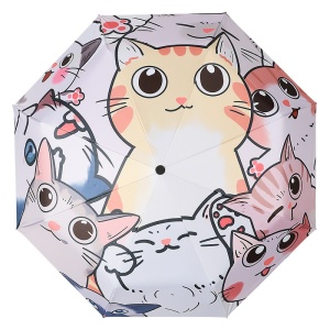 Tredubbelt paraply med kattmotiv mot vit bakgrund