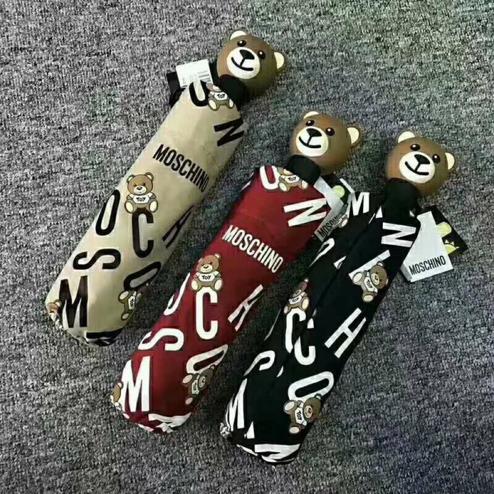 Barnparaply med handtag av björnhuvud Beige, rött och svart barnparaply med björnhuvudhandtag på grå matta