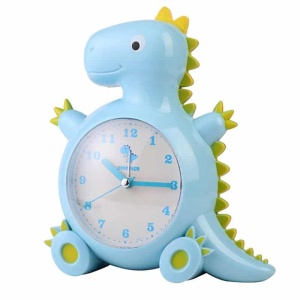 Väckarklocka för barn i form av en blå och grön dinosaurie mot en vit bakgrund